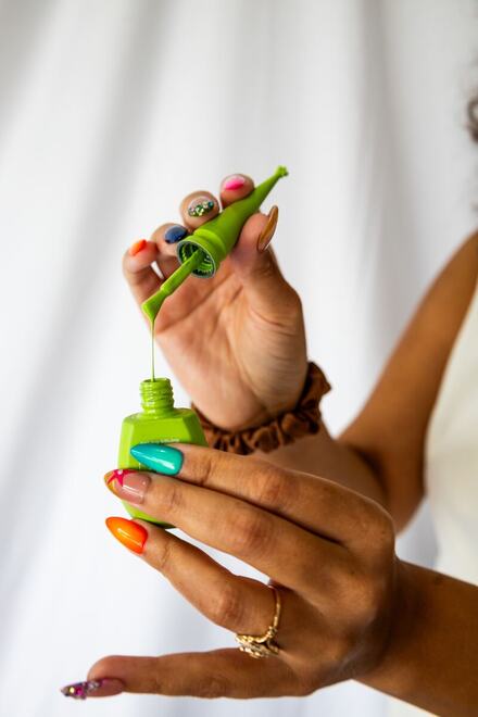 Painted nails and a handful of polish, in the studio